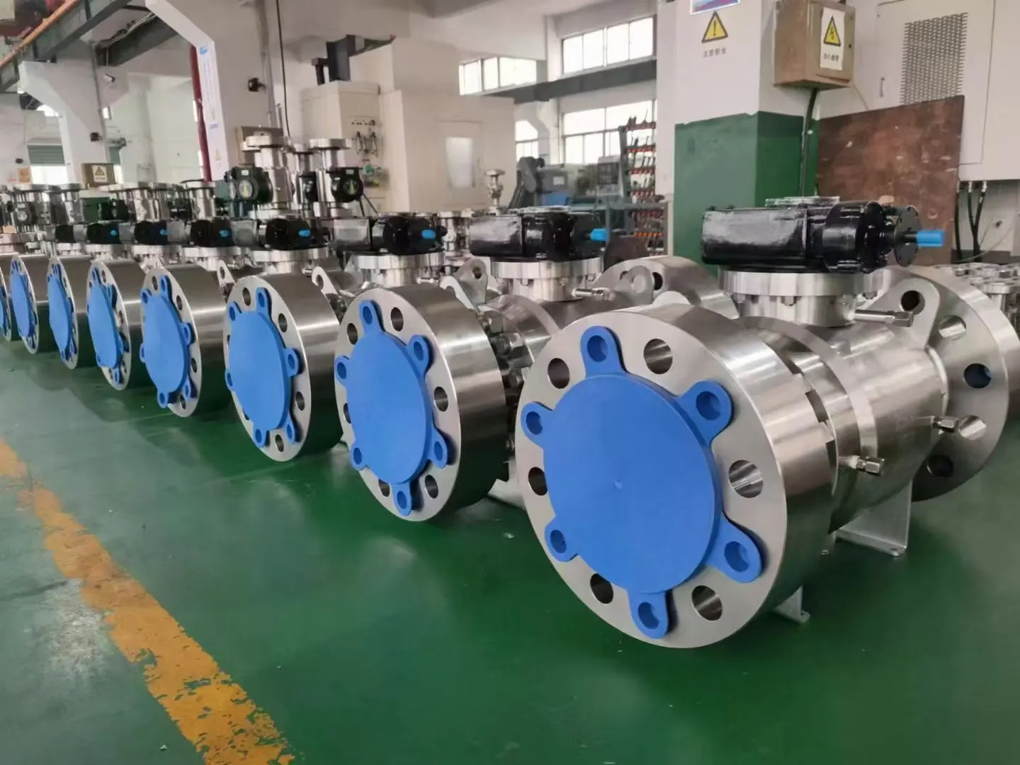 Finished large ball valves lined up in the factory